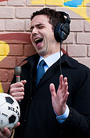 Eli as Roger Bozack in the Pop World Cup